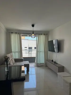 Uma televisão e/ou sistema de entretenimento em Apartamento a dois passos da beira mar