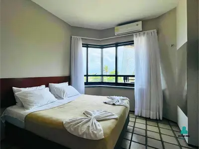 Uma cama ou camas num quarto em Golden Flats Beira Mar by Holiday Stays