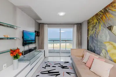 Uma televisão e/ou sistema de entretenimento em Apartamento Vista Mar
