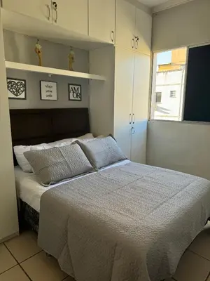 Uma cama ou camas num quarto em Encanto Parangaba