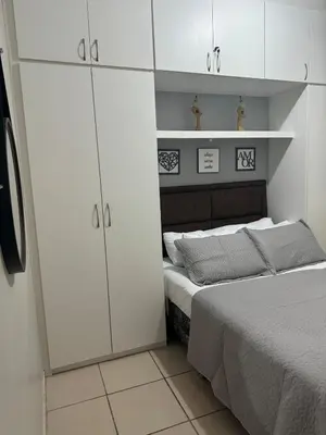 Uma cama ou camas num quarto em Encanto Parangaba