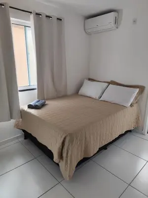 Uma cama ou camas num quarto em Cn Porto das Dunas