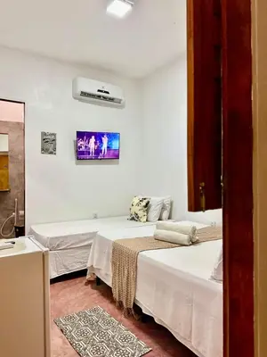 Uma cama ou camas num quarto em Pousada Zoom Jericoacoara