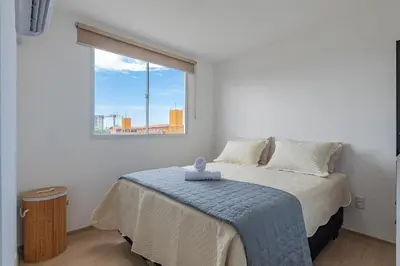 Uma cama ou camas num quarto em Mirante #303 2 Suítes Praia Futuro by Carpediem