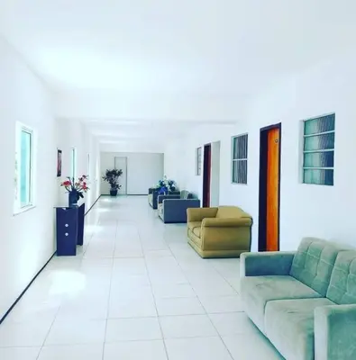 Uma área de estar em Hotel Dom Cláudio
