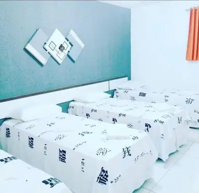 Uma cama ou camas num quarto em Hotel Dom Cláudio