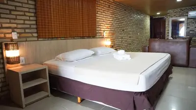 Uma cama ou camas num quarto em GoldMen Coliseum Beach Hotel