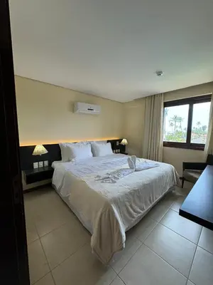 Uma cama ou camas num quarto em Kariri Beach Residence