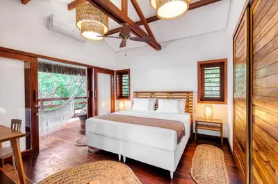 Uma cama ou camas num quarto em Deluxe Villa Luz Do Mar - Suites Privativas