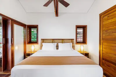 Uma cama ou camas num quarto em Deluxe Villa Luz Do Mar - Suites Privativas