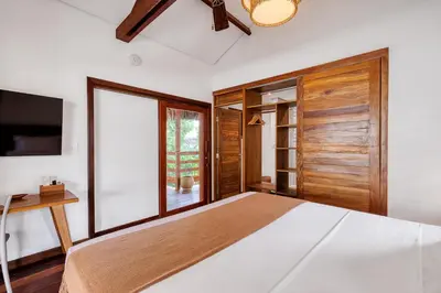 Uma cama ou camas num quarto em Deluxe Villa Luz Do Mar - Suites Privativas