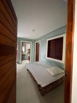 Uma cama ou camas num quarto em Casa da Cabana Guajiru