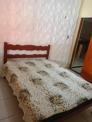 Uma cama ou camas num quarto em Casa em Paracuru