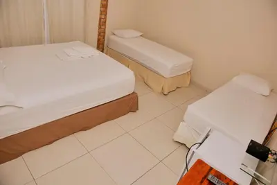 Uma cama ou camas num quarto em Pousada Da Eva