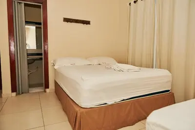 Uma cama ou camas num quarto em Pousada Da Eva