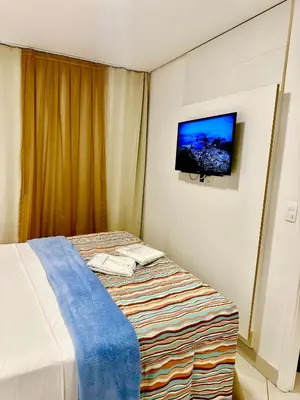 Uma cama ou camas num quarto em Ed Landscape Apt Luxo de 2 quartos Frente Mar