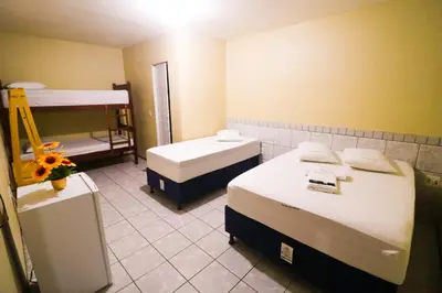 Uma cama ou camas num quarto em Pousada Dom Manuel - Ce
