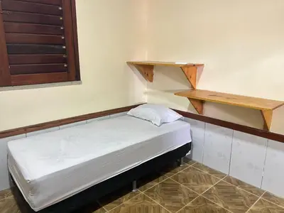 Uma cama ou camas num quarto em Casa Rumaré