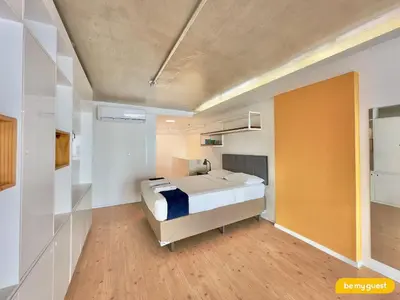 Uma cama ou camas num quarto em Loft Praia - Meireles