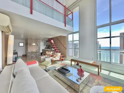 Uma área de estar em Loft Praia - Meireles