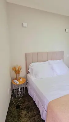 Uma cama ou camas num quarto em Hotel Brasil PREMIUM 604