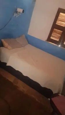 Uma cama ou camas num quarto em Apartamento Para o Carnaval