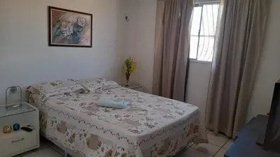 Uma cama ou camas num quarto em Apartamento aconchegante na Cidade 2000