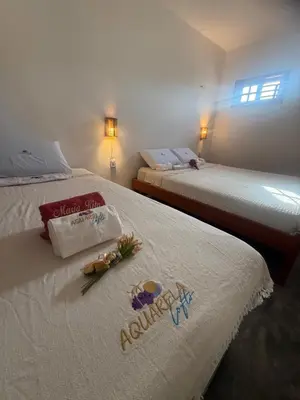 Uma cama ou camas num quarto em Aquarela Lofts em Icaraizinho