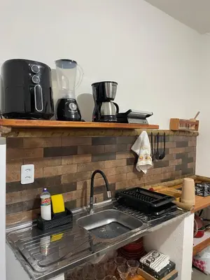 A cozinha ou kitchenette de Aquarela Lofts em Icaraizinho