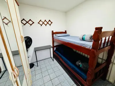 Uma cama ou camas num quarto em Vista mar, piscina, na praia do futuro, com Ar condicionado e Wi-Fi