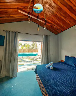 Uma cama ou camas num quarto em Pousada no Mar