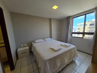 Uma cama ou camas num quarto em Emílio Hinko 2304 Mucuripe andar alto perto Beira Mar