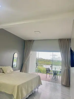 Uma cama ou camas num quarto em Villa brisa icaraizinho Quarto 6 andar superior