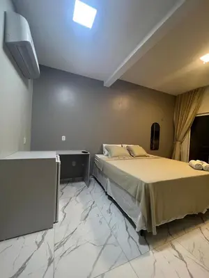 Uma cama ou camas num quarto em Villa brisa icaraizinho Quarto 6 andar superior