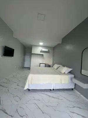Uma cama ou camas num quarto em Villa brisa icaraizinho Quarto 6 andar superior