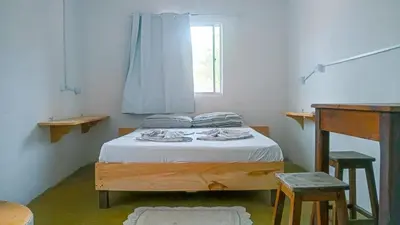 Uma cama ou camas num quarto em Hostel Jericoacoariano