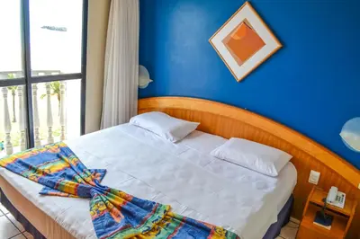 Uma cama ou camas num quarto em Hotel Flat Classic