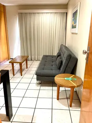 Uma área de estar em Hotel Flat Classic
