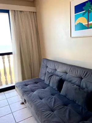 Uma área de estar em Hotel Flat Classic