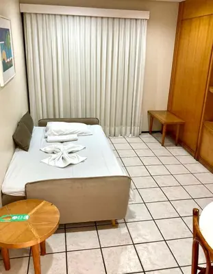 Uma cama ou camas num quarto em Hotel Flat Classic