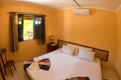 Uma cama ou camas num quarto em Pousada Sitio Phoenix