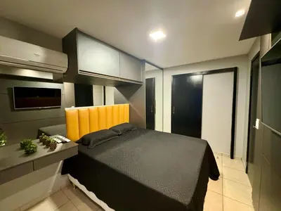 Uma cama ou camas num quarto em Praia do Futuro Fortaleza