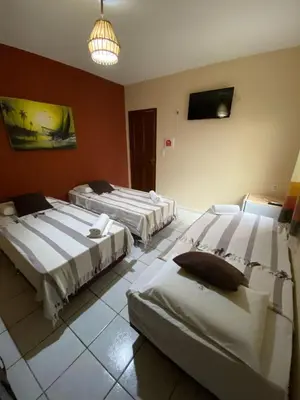 Uma cama ou camas num quarto em Residencial Dragão