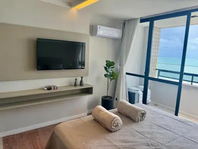 Uma televisão e/ou sistema de entretenimento em Suíte com varanda frente Mar - Golden Fortaleza-16513