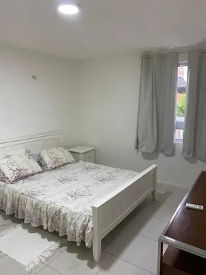 Uma cama ou camas num quarto em Terra mares Porto das dunas