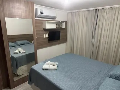 Uma cama ou camas num quarto em Cond Sol Maior 201 A Mucuripe