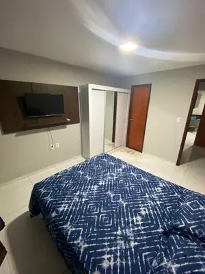 Uma cama ou camas num quarto em Ap no campo dos velhos com ar