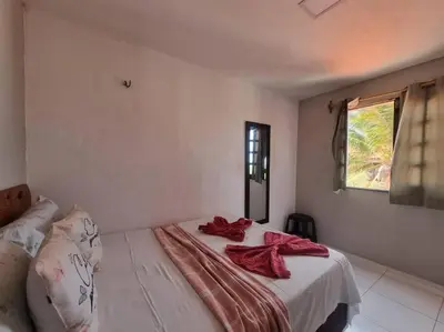 Uma cama ou camas num quarto em Casa sol nascente