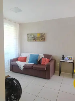 Uma área de estar em Apartamento Porto das Dunas