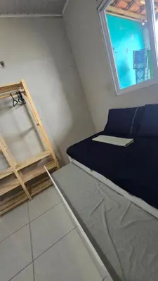 Uma cama ou camas num quarto em Pousada Madri